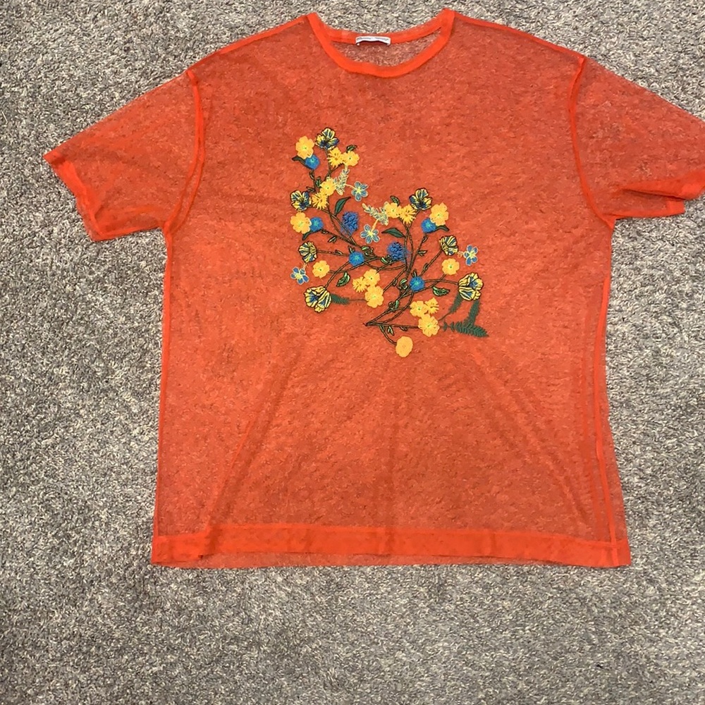 Orange see through top with floral design